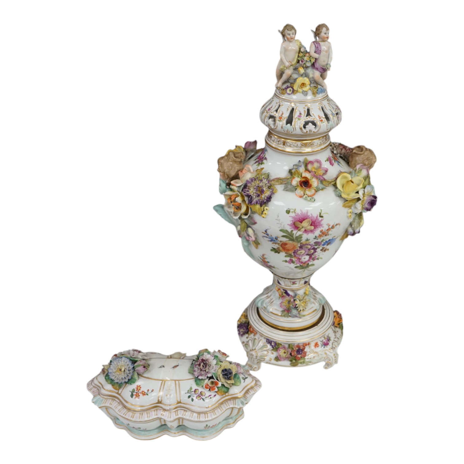 A Dresden floral encrusted porcelain incense burner hand painted with figures annd flowers, together with a similar lidded box, largest 52cm high. Condition - some losses